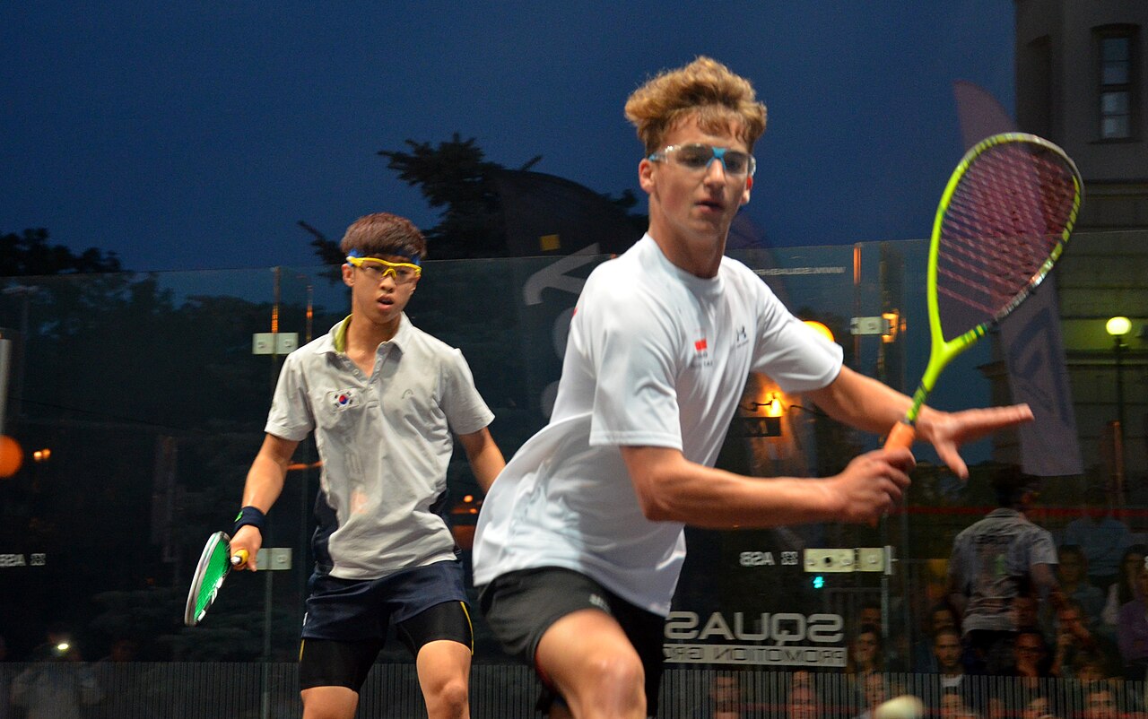 Young players competing at a junior squash championship